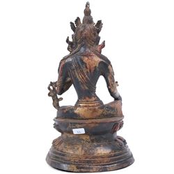 20th century bronzed buddha, with one hand raised, seated upon a lotus leaf, H27cm