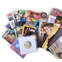 Signed bottle of Rod Stewart edition Wolfie's blended scotch whisky, together with Rod Stewart memorabilia, including first edition of his autobiography, colour photograph and two 7 inch singles, DVD sleeve 'Rod Stewart Live at Royal Albert Hall' signed by both Rod Stewart and Penny Lancaster, framed, tour programmes including 2019 world tour and a collection of Fan Club magazines