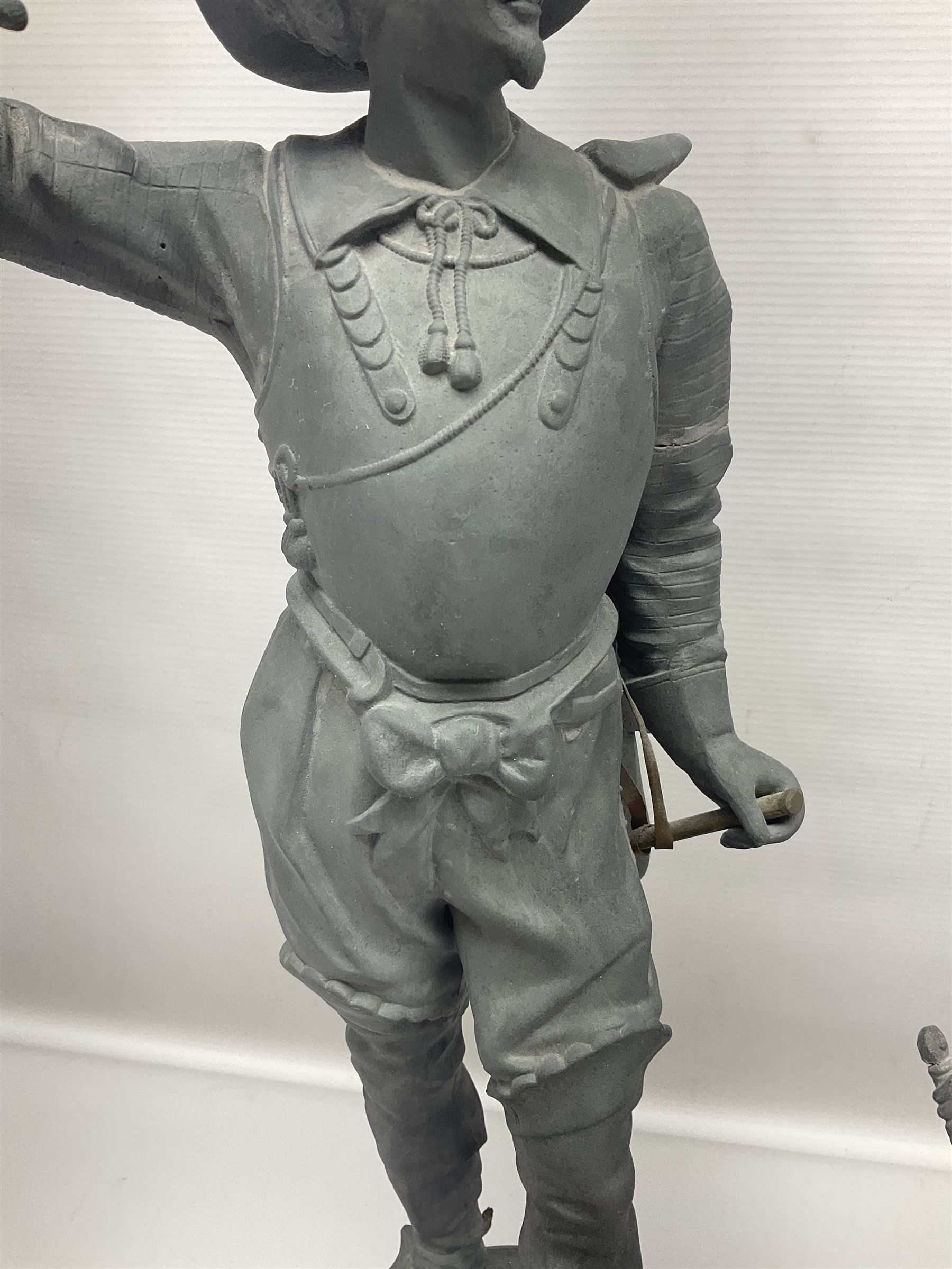 Pair of spelter figures modeled as Cavaliers, together with a spelter figure of Joan of Arc, largest H52cm