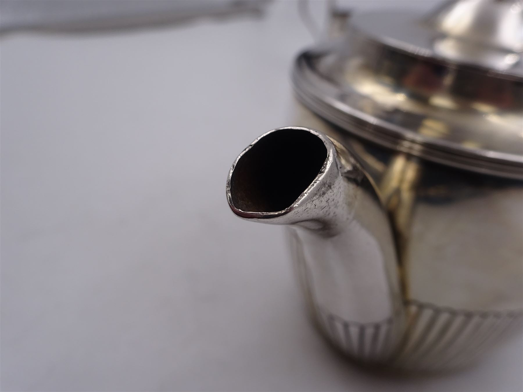 1930s American silver three piece batchelors tea service, comprising teapot, twin handled open sucrier and milk jug, each of part fluted oval form, the teapot with personal engraving to body, wood effect handle and silver urn shaped finial, stamped sterling with maker's mark for Gorham, teapot H13cm