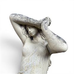 Composite stone garden figure of a scantily clad lady