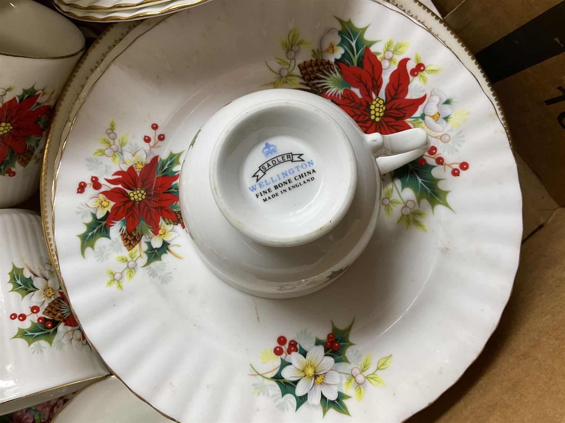 Royal Albert Poinsettia pattern part tea service, including tea cups, mugs, dessert plates, cake plate, together with James Kent plates, Crown Staffordshire Vermouth ceramic decanter label, glassware etc, two boxes 