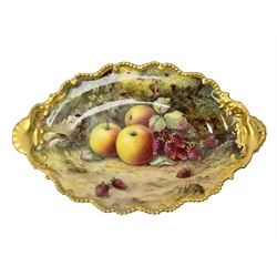 Early 20th century Royal Worcester dish decorated by Thomas Lockyer, oval form with gilt shaped rim and twin shell handles, hand painted with a still life of fruit upon a mossy ground, signed T Lockyer, with puce printed mark beneath and date code for 1922, W31cm