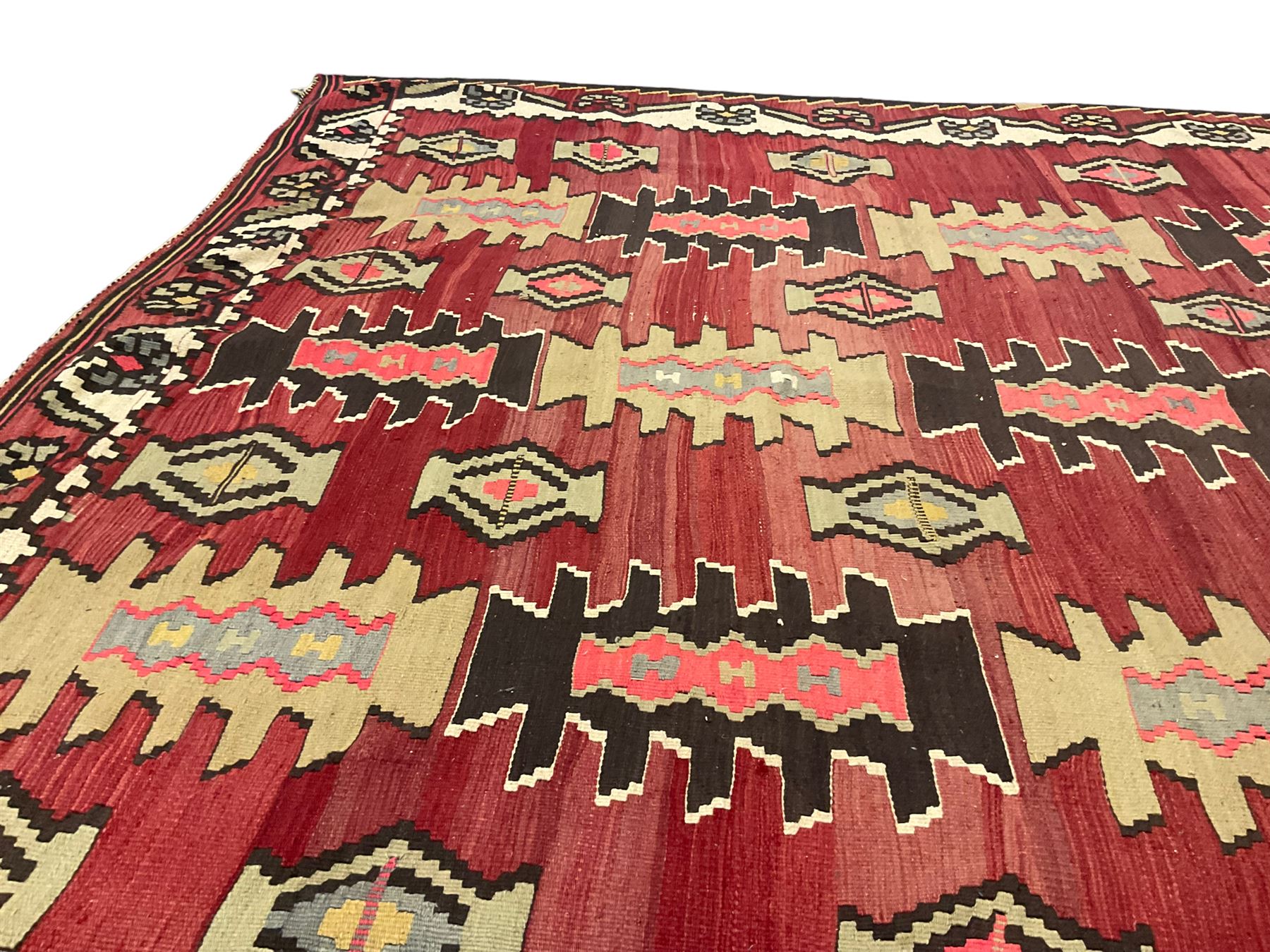 Large  red ground Kilim rug or wall hanging, decorated with geometric patterns and dated within the weave '1969'