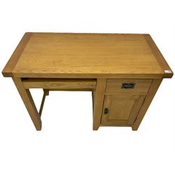 Light oak single pedestal desk, fitted with cupboard and drawer