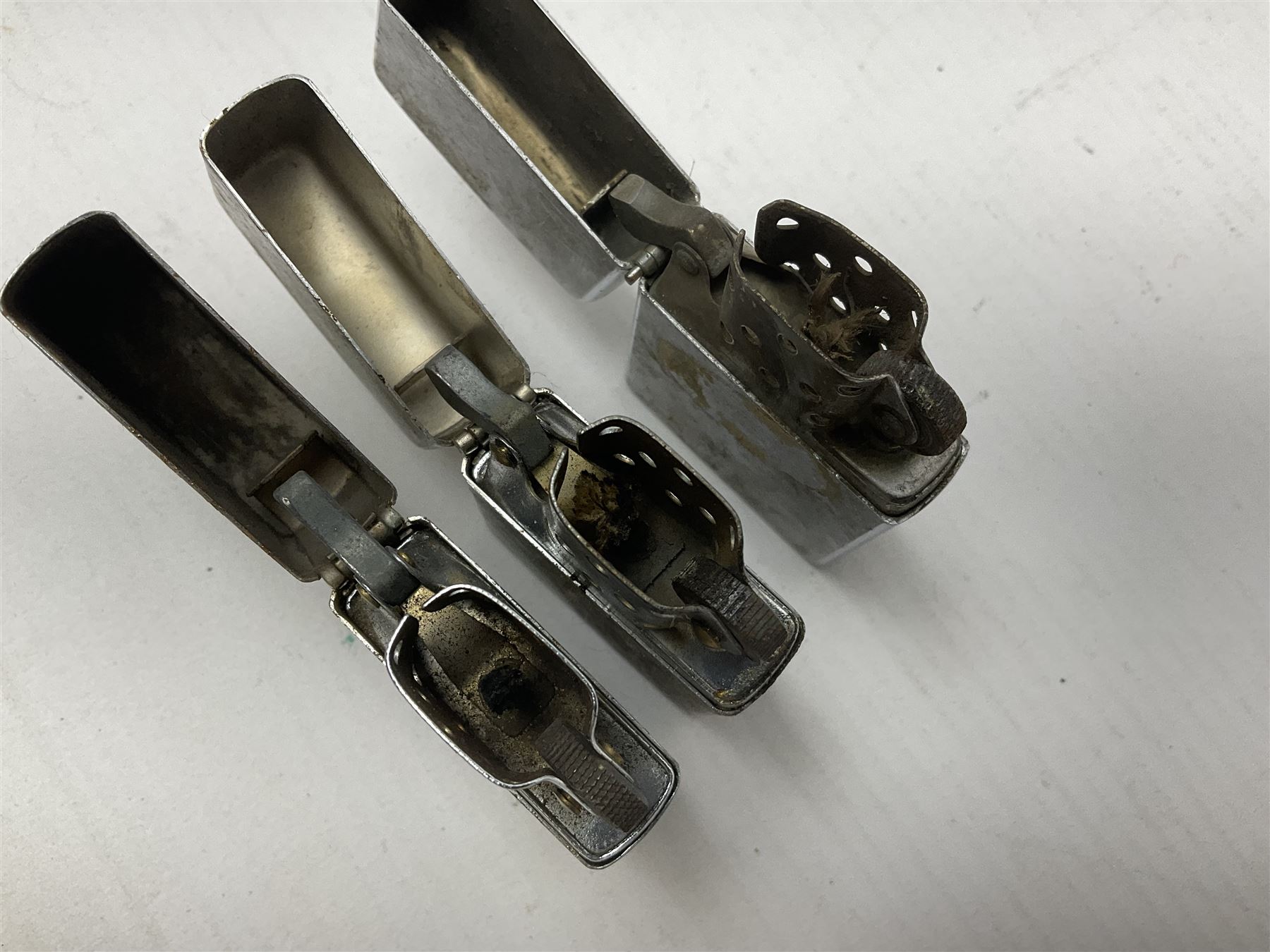 Collection of lighters, including Ronson Varaflame, Zorr Classic, Dunhill bark effect roller gas lighter, and faceted blue glass table lighter, etc