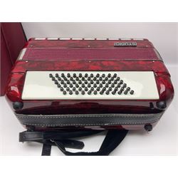 Hsinghai Studio piano accordion with red pearline finish, twenty keys and seventy-two buttons W44cm; in hard carrying case with additional The Music Room soft gig case