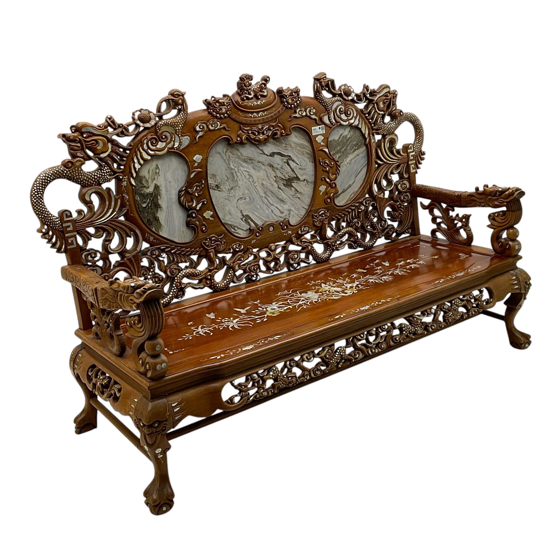 Chinese hardwood three-seat sofa, shaped back inset with three grey marble panels, decorated with carved dragons and birds with flower heads, inlaid with mother of pearl, the seat panel decorated with trailing foliage, flowers and birds inlay, on ball and claw carved cabriole feet united by stretchers