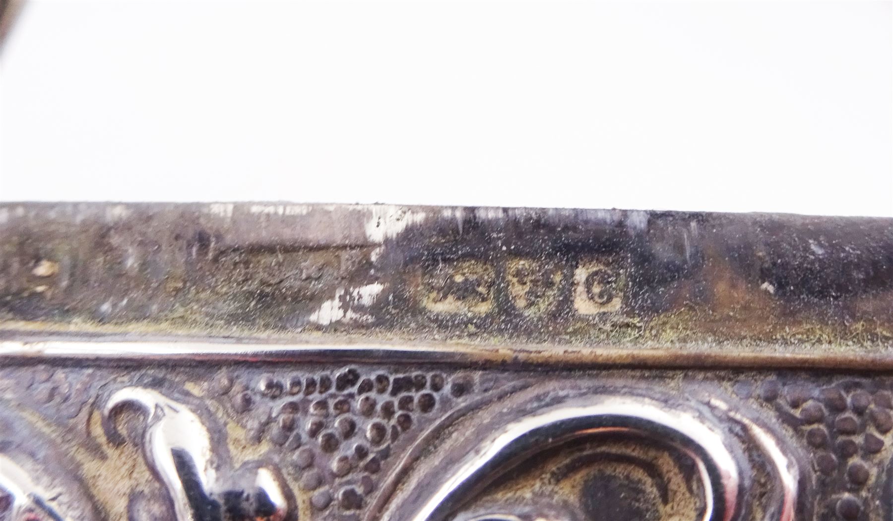 Edwardian silver card case, of typical rectangular form, with embossed floral and scrolling decoration throughout, engraved with monogrammed initials to front cover, hallmarked Cornelius Desormeaux Saunders & James Francis Hollings (Frank) Shepherd, Chester 1903, H9.7cm