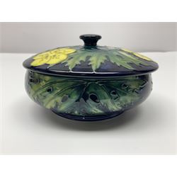 Moorcroft dish and cover, of circular form, decorated in Buttercup pattern, together with a Moorcroft vase, of baluster form, decorated in Magnolia pattern, both with printed marks beneath, tallest H9.5cm