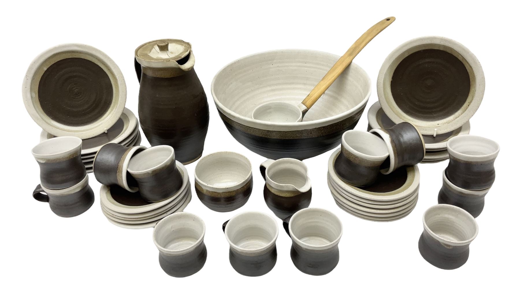 Marianne De Trey (British 1913-2016) stoneware coffee service for twelve, together with a large deep stoneware footed bowl and ladle with wood handle, all decorated in Manganese 'Pattern 1' with impressed shell marks, bowl D27cm