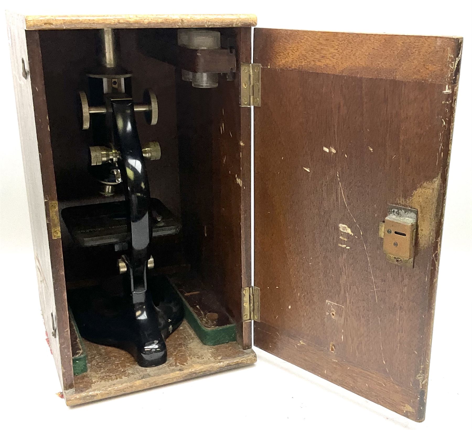 Black finished monocular microscope by Prior London No. 17372,  with pitchfork base and rack and pinion focusing, in original fitted wooden case with additional lenses, H32cm, together with Watts dumpy level, no. 116249, in a leather case