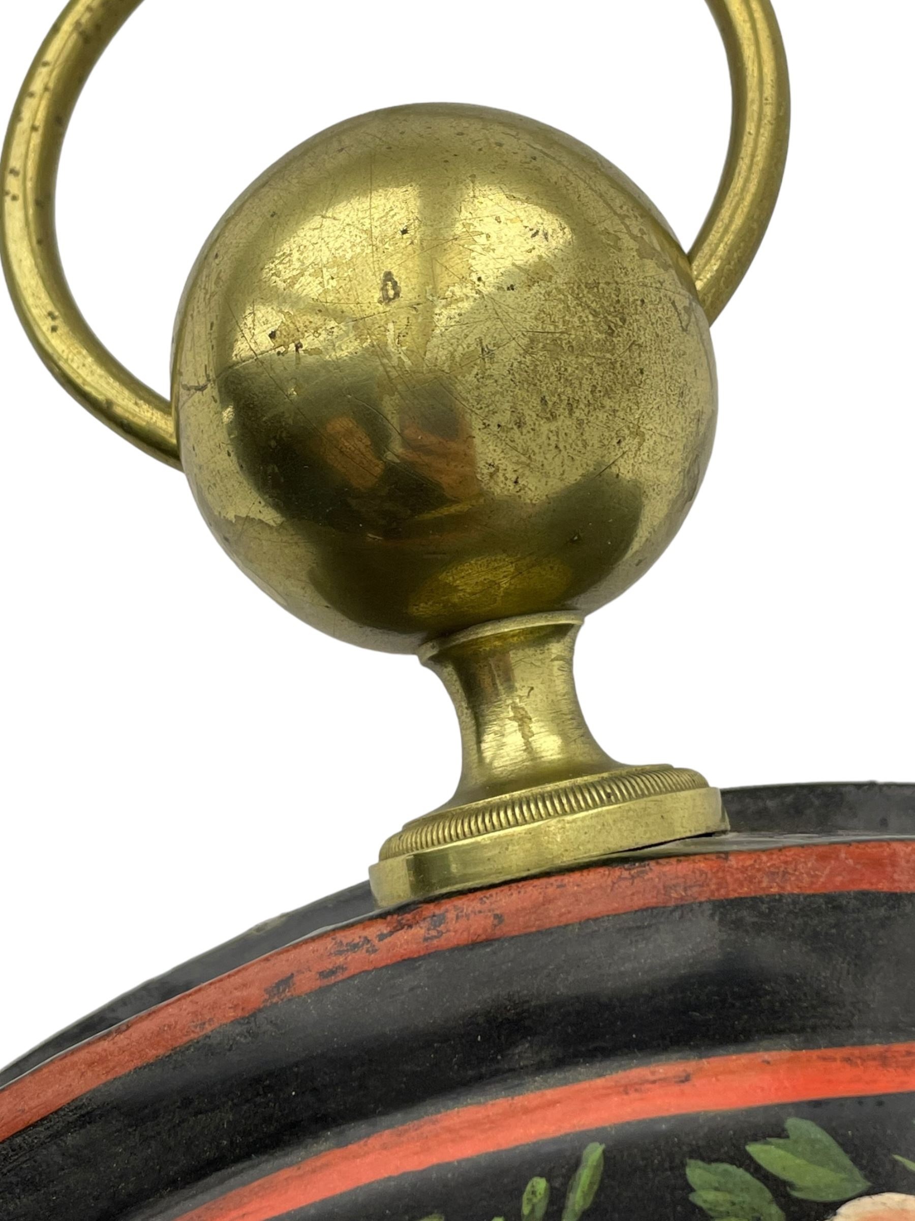 Honore Pons of Paris -  A good and early 19th century Tole Ware wall clock c1830, with a later re-decorated case suspended from a circular brass hanger, cast brass dial bezel and silvered engine turned dial with roman numerals, minute track and steel moon hands, 8-day twin train countwheel striking movement with a silk suspension, striking the hours and half hours on a bell. With pendulum and key.
