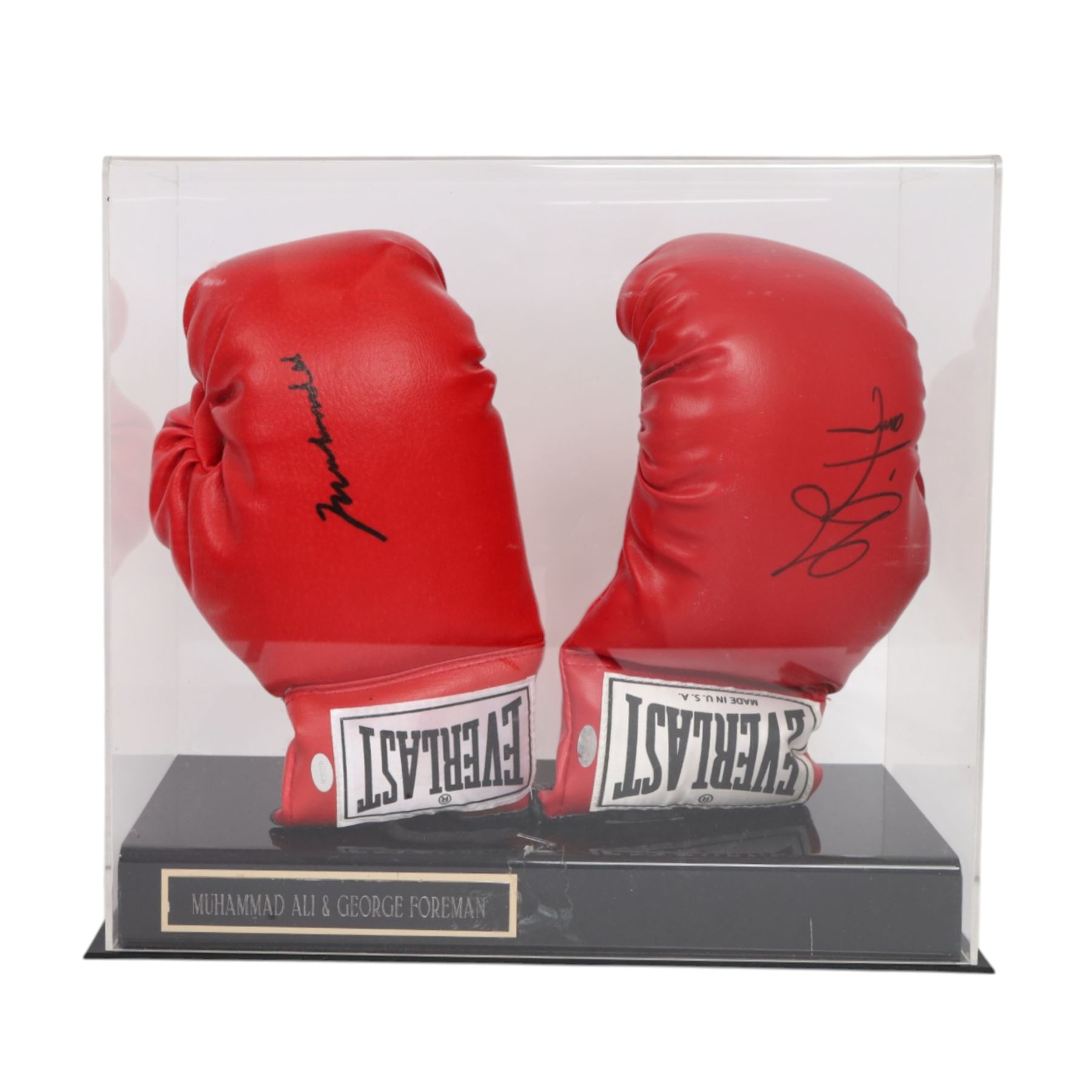 Muhammad Ali and George Foreman signed boxing gloves, two Everlast gloves the left hand glove signed by Ali and right signed by Foreman, both in black marker pen, in Perspex display case with plaque to base displayed with a further unsigned glove, each with Mounted Memories holographic stickers, case H36cm