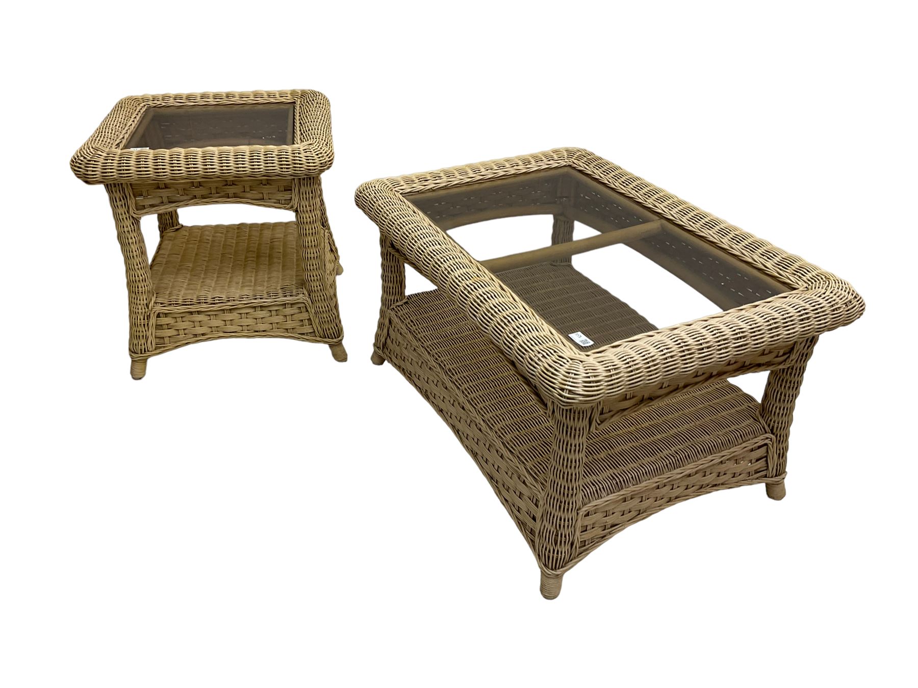 Contemporary rattan conservatory suite - two seat sofa with wicker frame and loose cushions upholstered in textured champagne fabric (W125cm H98cm); pair of matching armchairs (W72cm H98cm); rectangular glass-topped coffee table with rattan frame and undertier (W85cm D60cm H47cm); and matching square side table (W53cm H55cm)