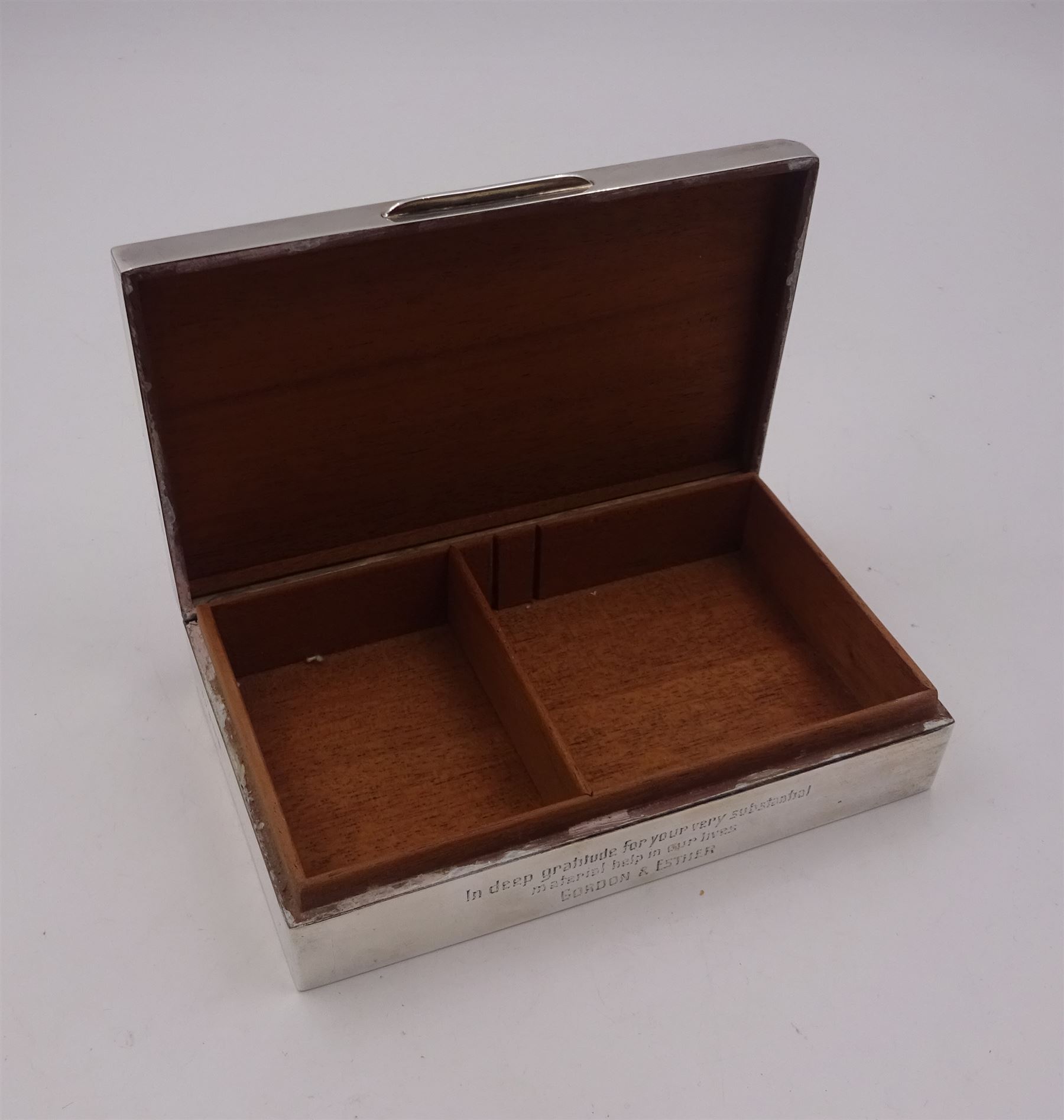 Modern silver mounted cigarette box, of rectangular form, with personal enraving to front and engine turned decoration and initials to cover, opening to reveal soft wood lined partitioned interior, hallmarked Frederick Field Ltd, Birmingham 1962