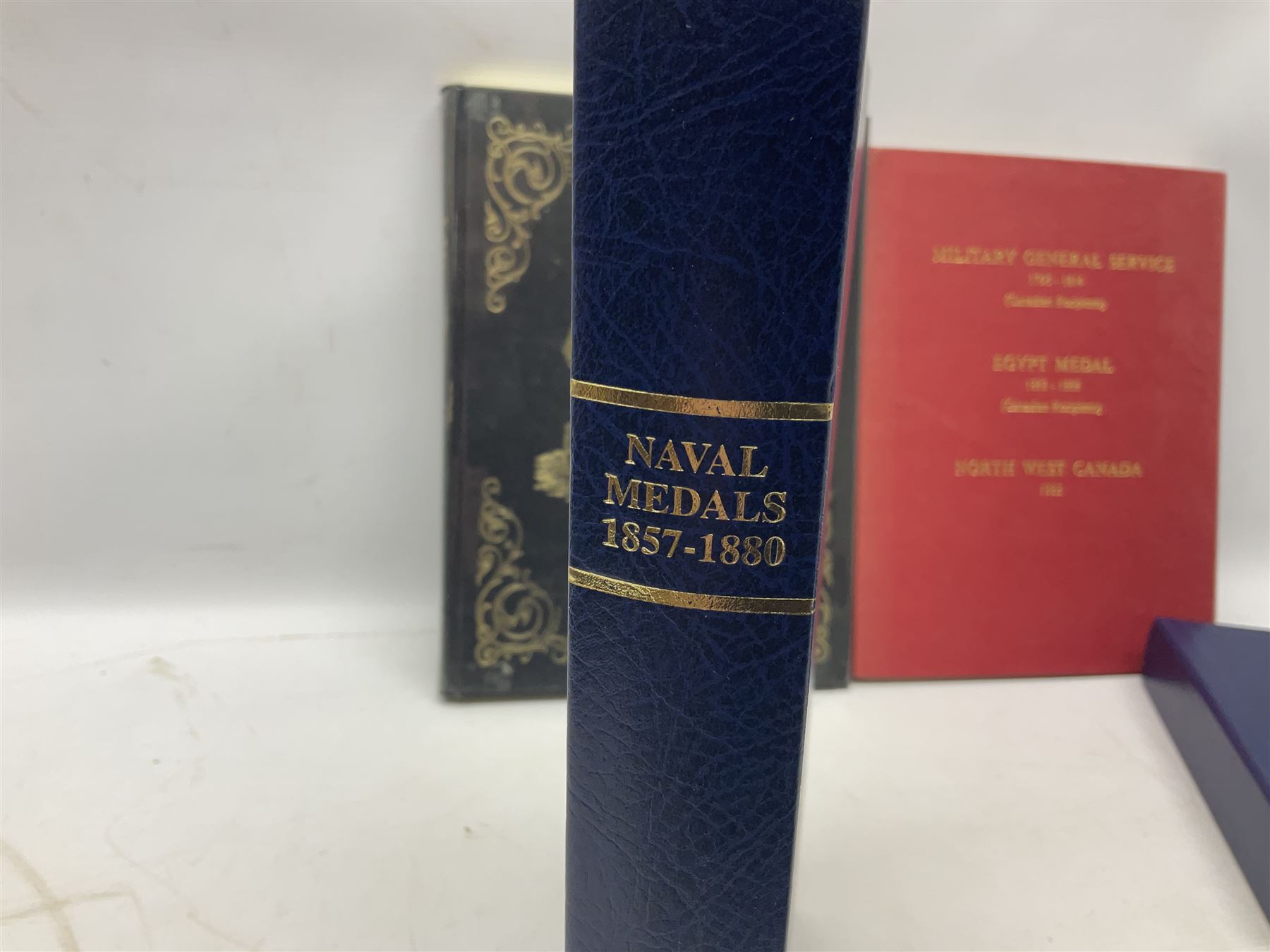 Six medal collectors reference books including Douglas-Morris Kenneth: Naval Medal 1857-1880. 1994 in slip-case; Casualty Roll For The Zulu and Basuto Wars South Africa 1877-79; Abbott P.E.: Recipients of the Distinguished Conduct Medal 1855-1909; Casualty Roll For The Crimea 1854-1855; and two others (6)