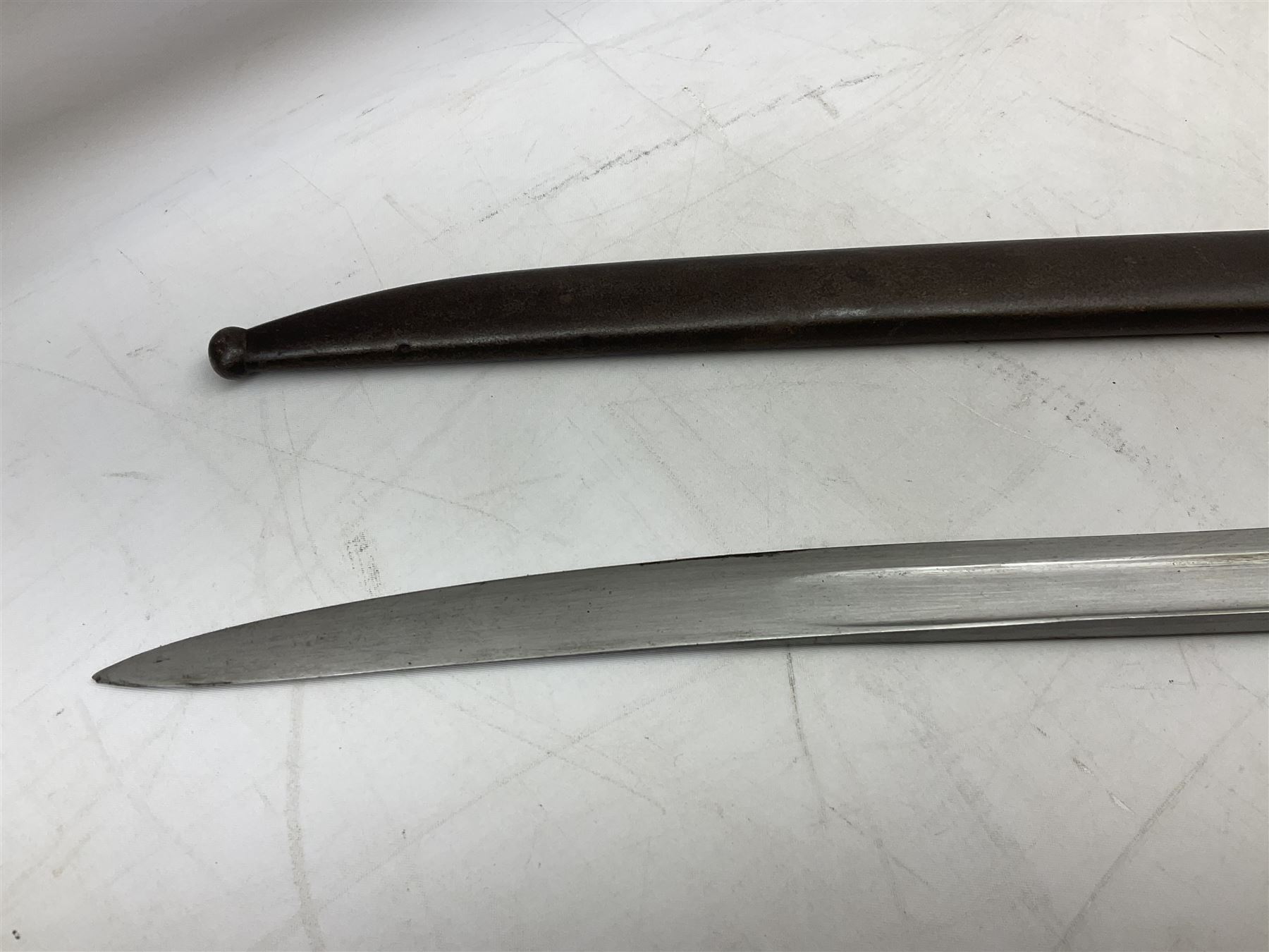 French model 1866 sabre bayonet, the 57.5cm curving blade marked St. Etienne 1868; in associated steel scabbard L71cm overall