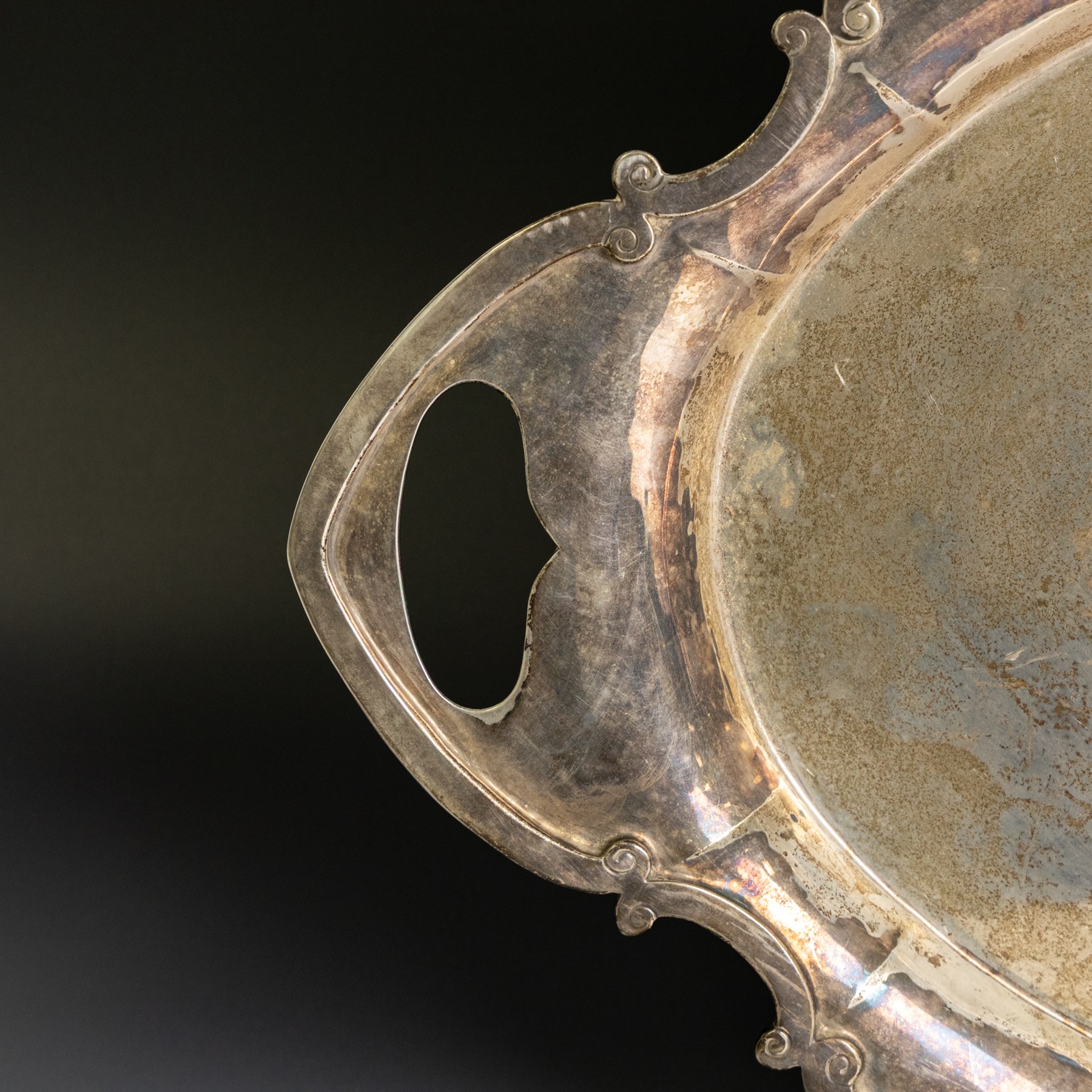 Edwardian silver twin handled tray, of navette form with C scroll decoration to the outer rim, hallmarked Goldsmiths & Silversmiths Ltd, London 1907, handle W61cm