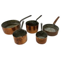 Five assorted graduated copper pans