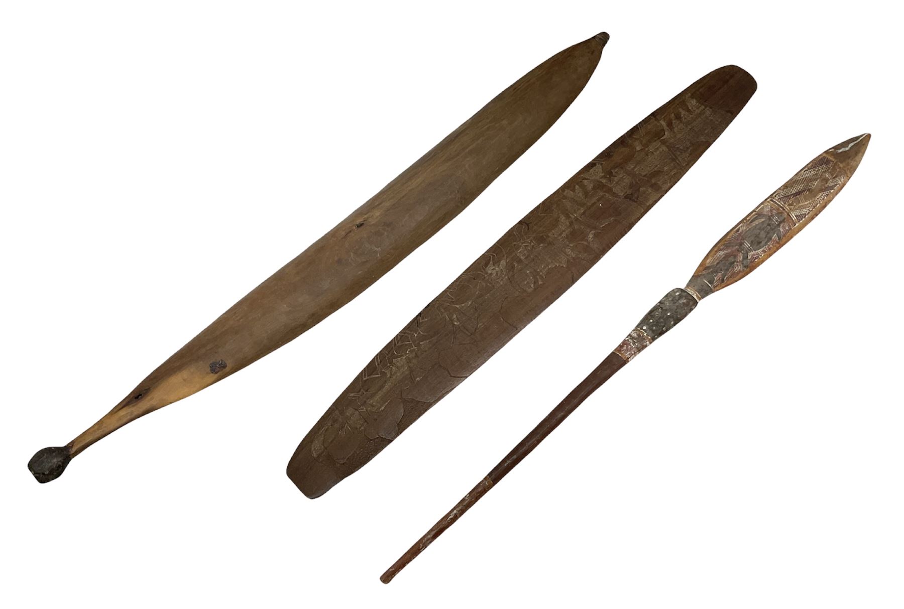 Australian Aboriginal shield, carved with Kangaroo and Emu, 74.5cm; Spear painted with aquatic creatures 78cm, and Spear thrower 81cm (3)