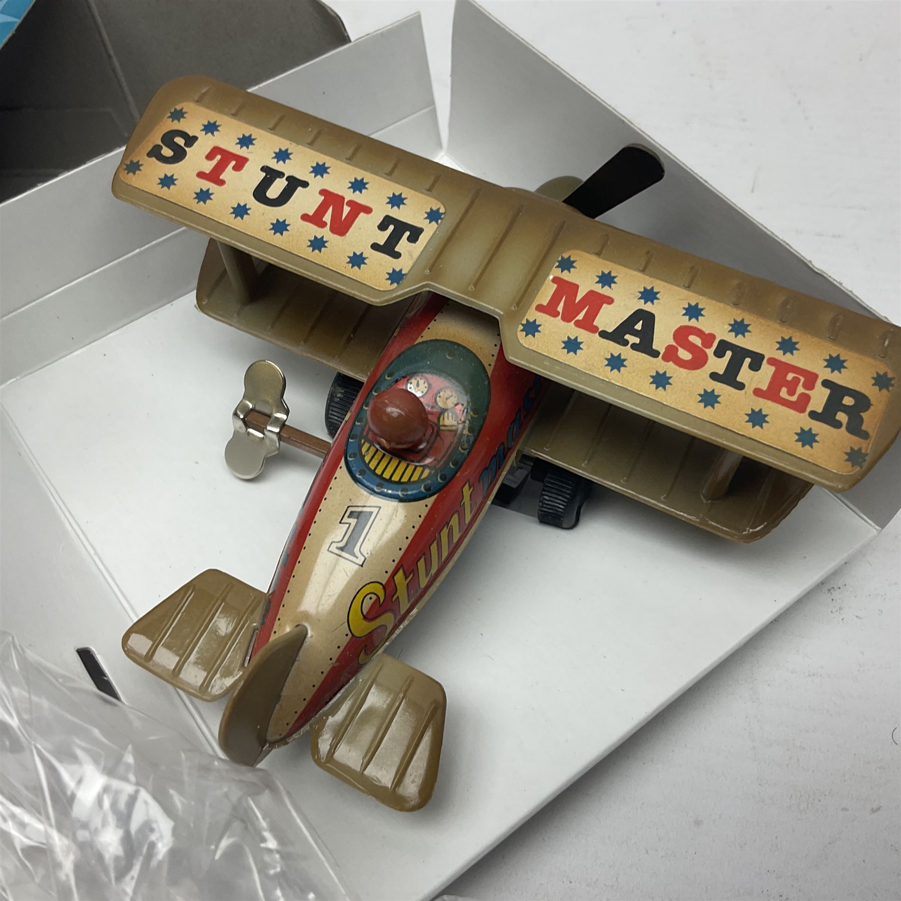 Twenty six tinplate models to include Ferris Wheel and Performing Circus Elephant, marked JW, further similar examples such as Duck on a Bike, Clown on Roller, Carousel; Popeye Tin Speedboat; Looney Tunes Wind Up Cars and Express Train; various international examples, MS107 Jumping Bambi, Pop Pop Boat, jumping frogs, pecking chickens etc; both boxed and loose