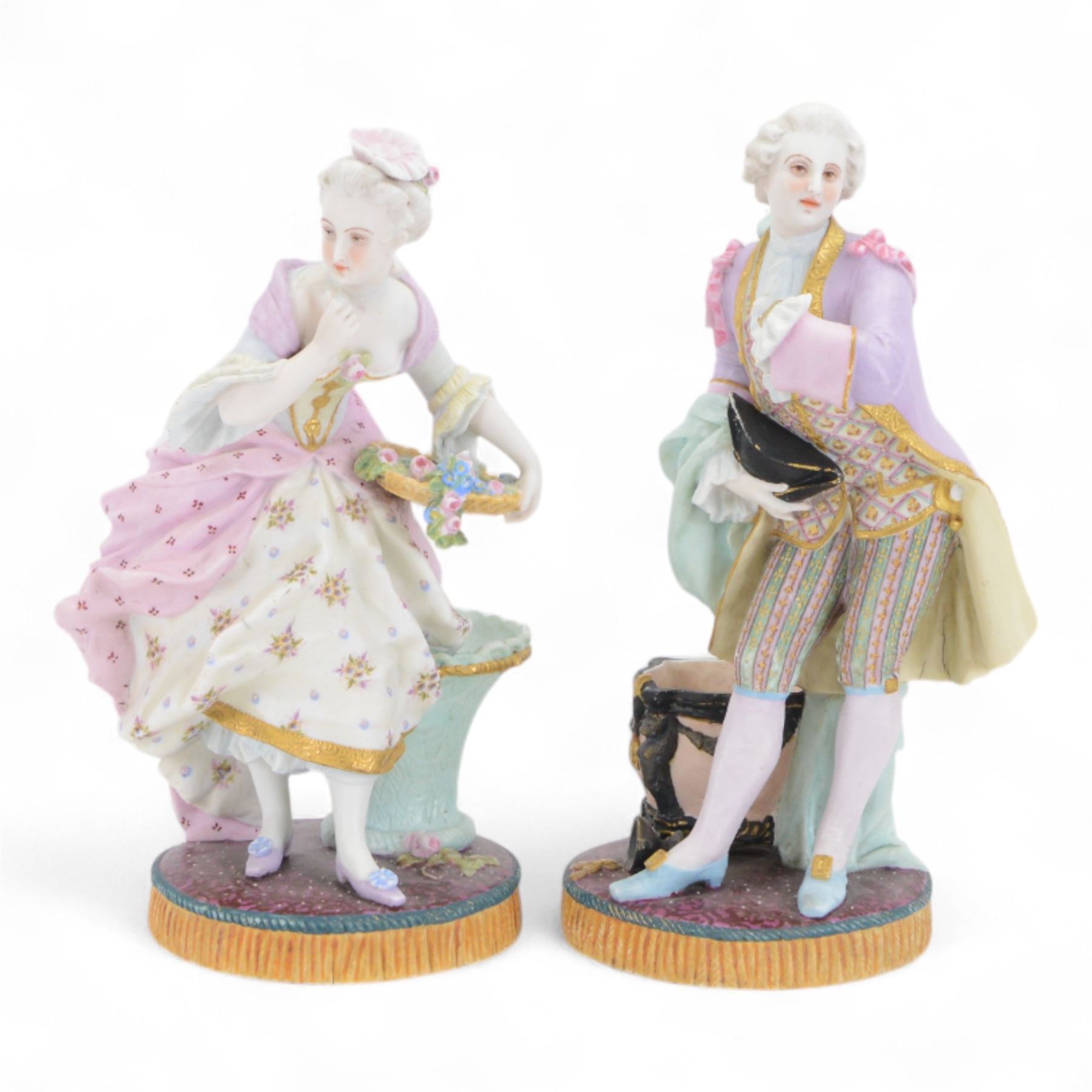 Pair of late 19th century French Letu & Mauger bisque figures, modelled as a gallant and his companion, with impressed marks beneath, H35.5cm, together with a 19th century French mantle vase, in the manner of Jacob Petit, the vase of cornucopia form painted with rose sprays and heightened with gilt, mounted with the figure of a trumpet player, upon a naturalistically modelled base mounted with a recumbent goat, H35cm