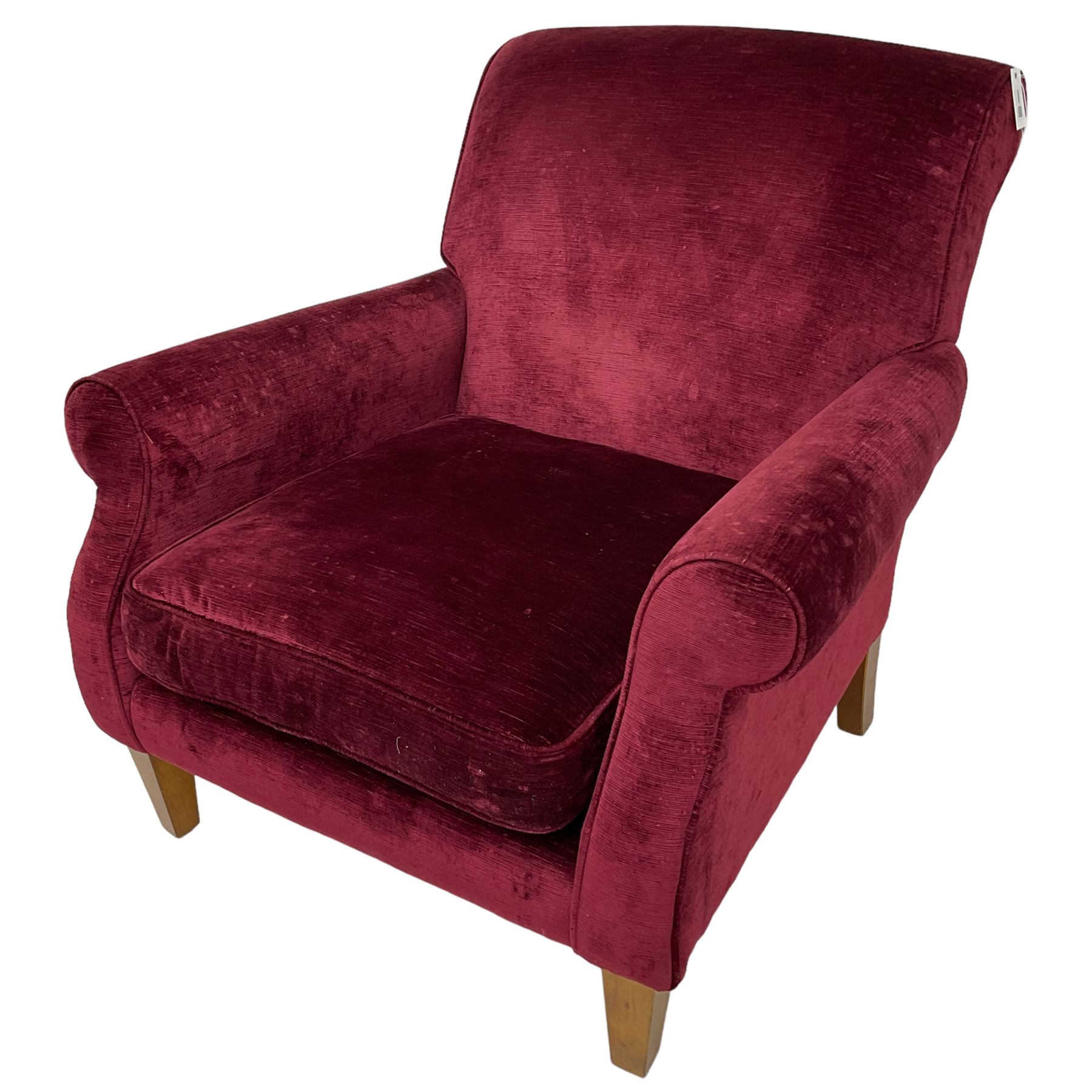 Duresta - traditional shape armchair upholstered in burgundy red velvet, on square tapering front supports (W88cm, H85cm, D103cm); together with a matching rectangular footstool with hinged seat, on turned feet with brass castors (73cm x 54cm, H38cm)