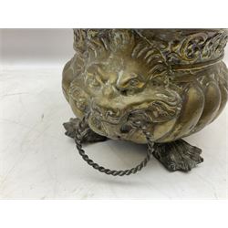 19th century repoussé brass jardinière with lion mask ring handles, of oval form raised upon four claw feet, L31cm