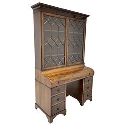 Early to mid-20th century rosewood and mahogany piano top secretaire bookcase, the projecting dentil cornice over two astragal glazed doors, the piano lid enclosing slide out writing surface with baize lining, pigeon holes and drawers, with inscribed brass presentation plaque 