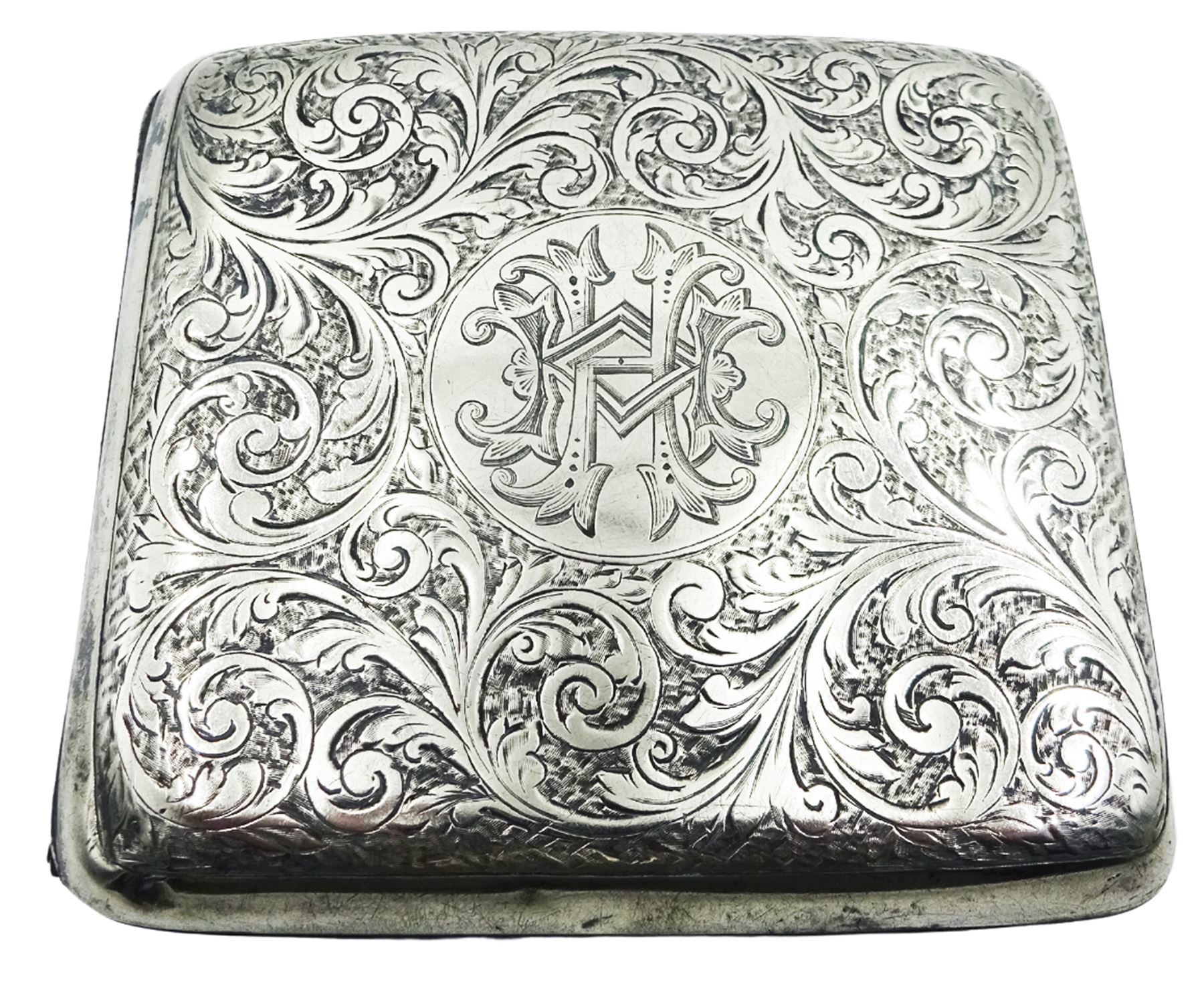 Edwardian silver cigarette case, of rounded rectangular form with engraved scrolling foliate decoration and central panel with monogram, hallmarked S Blanckensee & Son Ltd, Birmingham 1907, H8.5cm W9cm, approximate weight 3.22 ozt (100.3 grams)