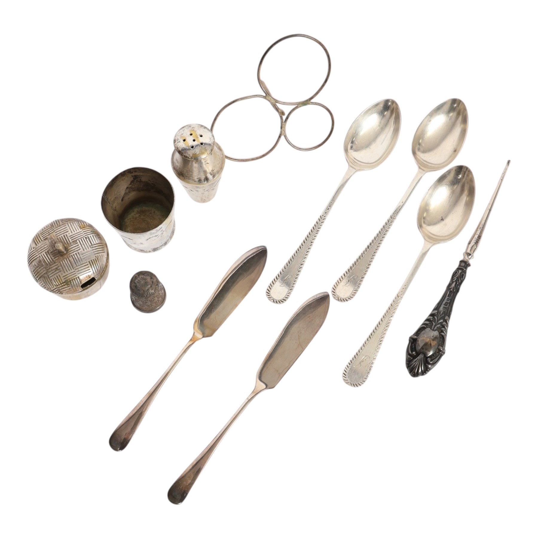 Silver cutlery comprising three teaspoons and two butter knives, a silver handled hook and a silver plated Chinese rickshaw cruet