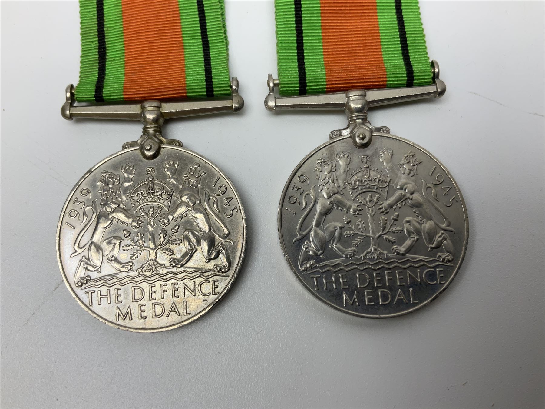 Ten WW2 medals comprising two 1939-1945 war medals, two Defence medals, two 1939-1945 Stars, two Africa Stars, France & Germany Star and Burma Star; together with bar of four miniature medals; all with ribbons