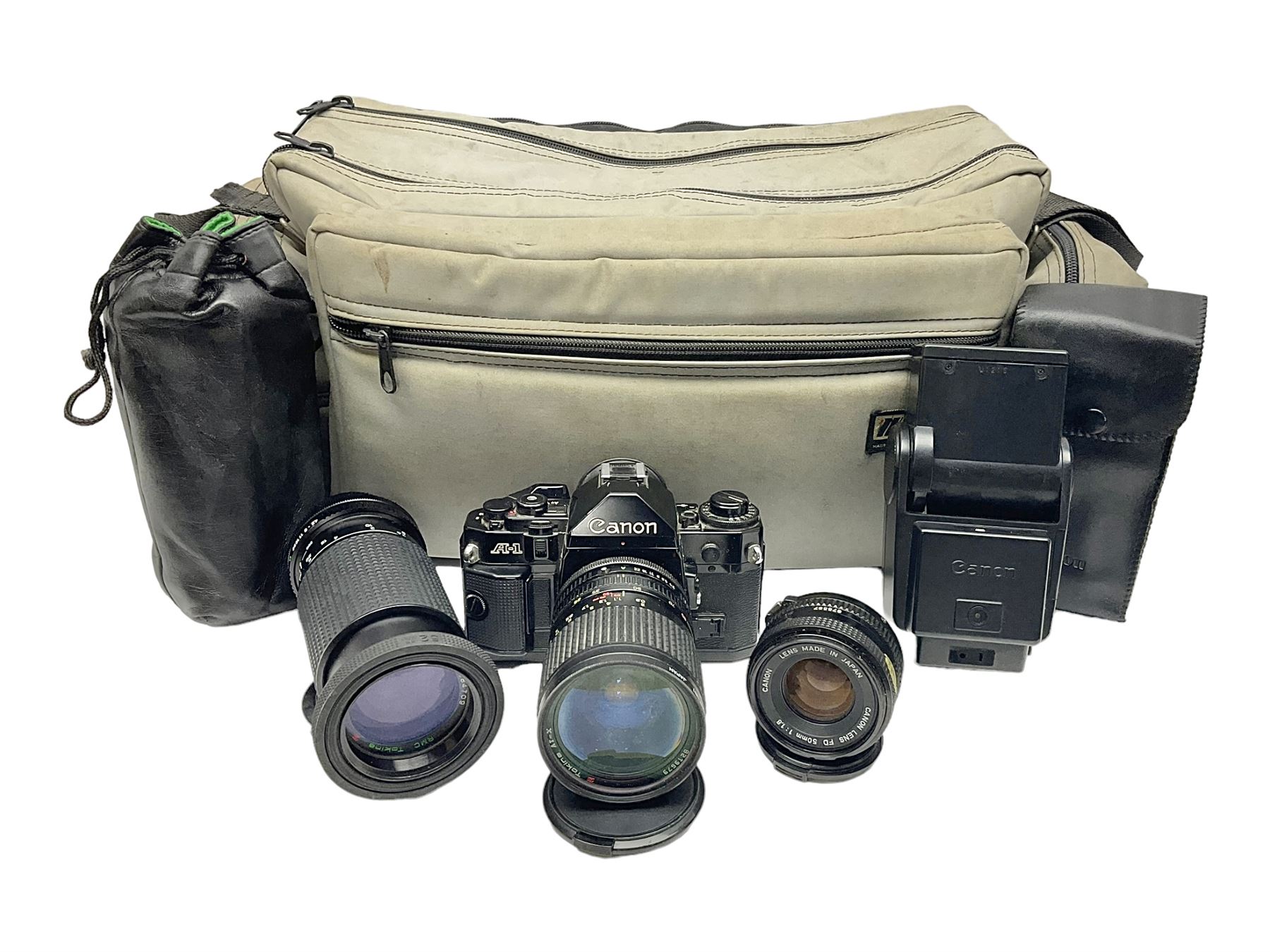 Canon A1 35mm camera body serial no 741264, with 'Tokina AT-X 28-85mm 1:3.5-4.5' lens serial no 821679, 'Canon FD 50mm 1:1.8mm' lens and other camera equipment 