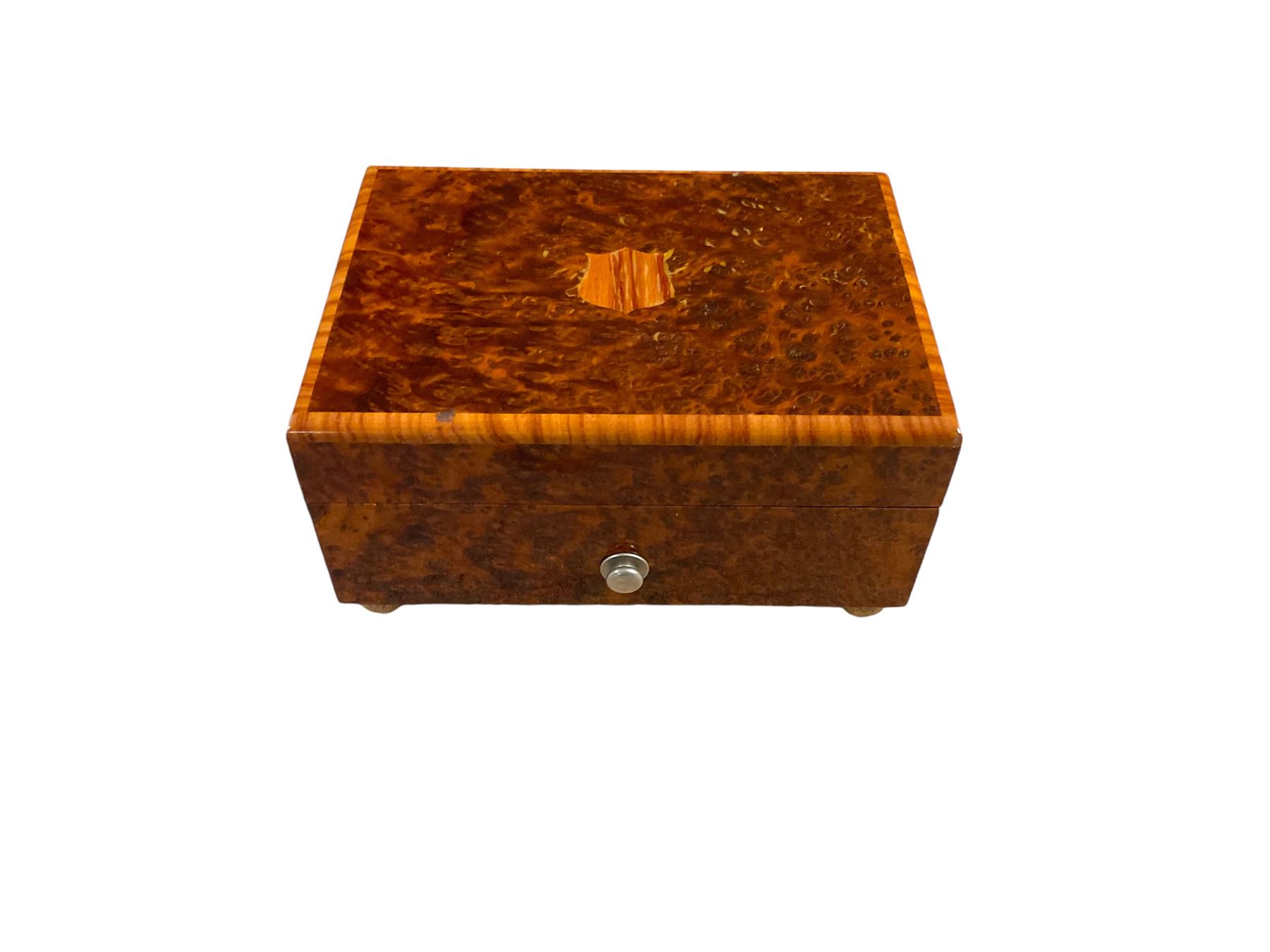 20th century burr wood Swiss musical box, marbled beneath 'made in Switzerland', paper label inscribed 'Around the world The Lass of Richmond Hill', H6.5cm W12.5cm D9cm
