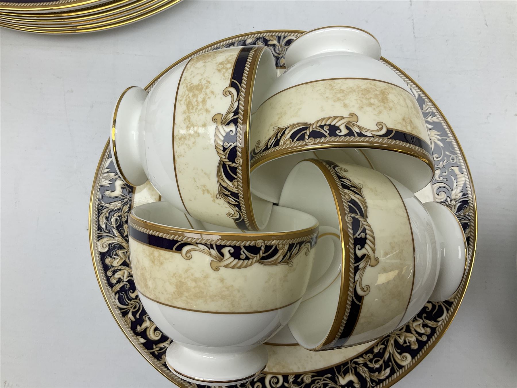 Wedgwood cornucopia pattern tea and dinner service, comprising teapot, ten cups and saucers, milk jug, open sucrier, eight dessert plates, fourteen dinner plates, eight side plates, six bowls, two open serving dishes and one covered twin handled dish (53)