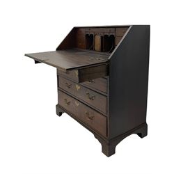 Georgian oak bureau, fall front enclosing fitted interior, four long graduating drawers, on bracket feet