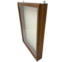 Walnut wall hanging display cabinet cabinet, enclosed by glazed door in moulded frame, fitted with glass shelves
