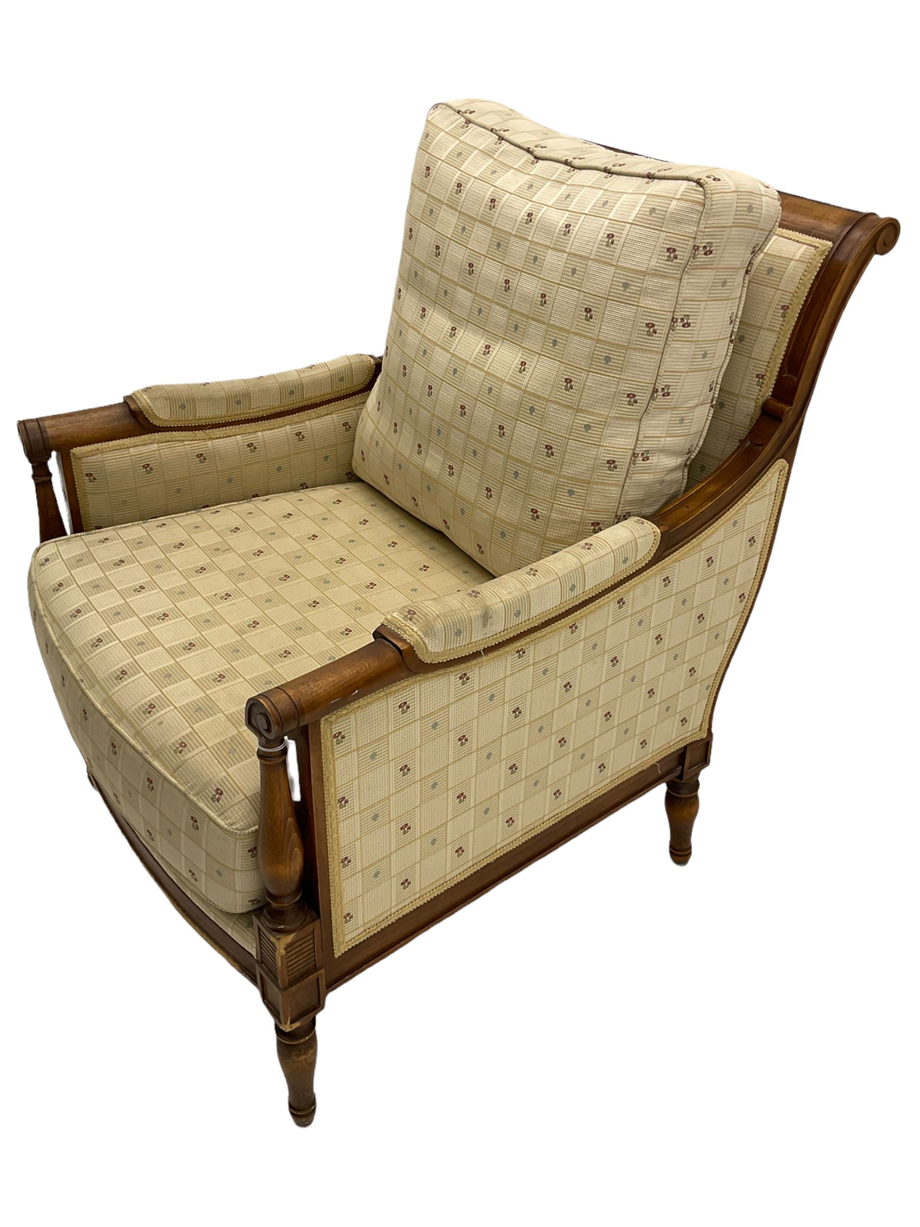 Wesley Barrell - beech framed armchair, upholstered in floral patterned fabric, on turned supports