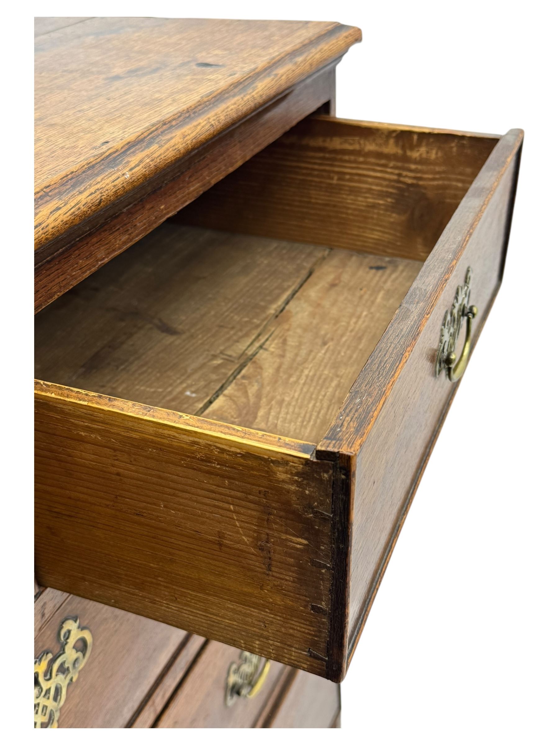 George III oak chest of drawers fitted with two short over four long drawers fitted with swan neck handles, supported on bracket feet