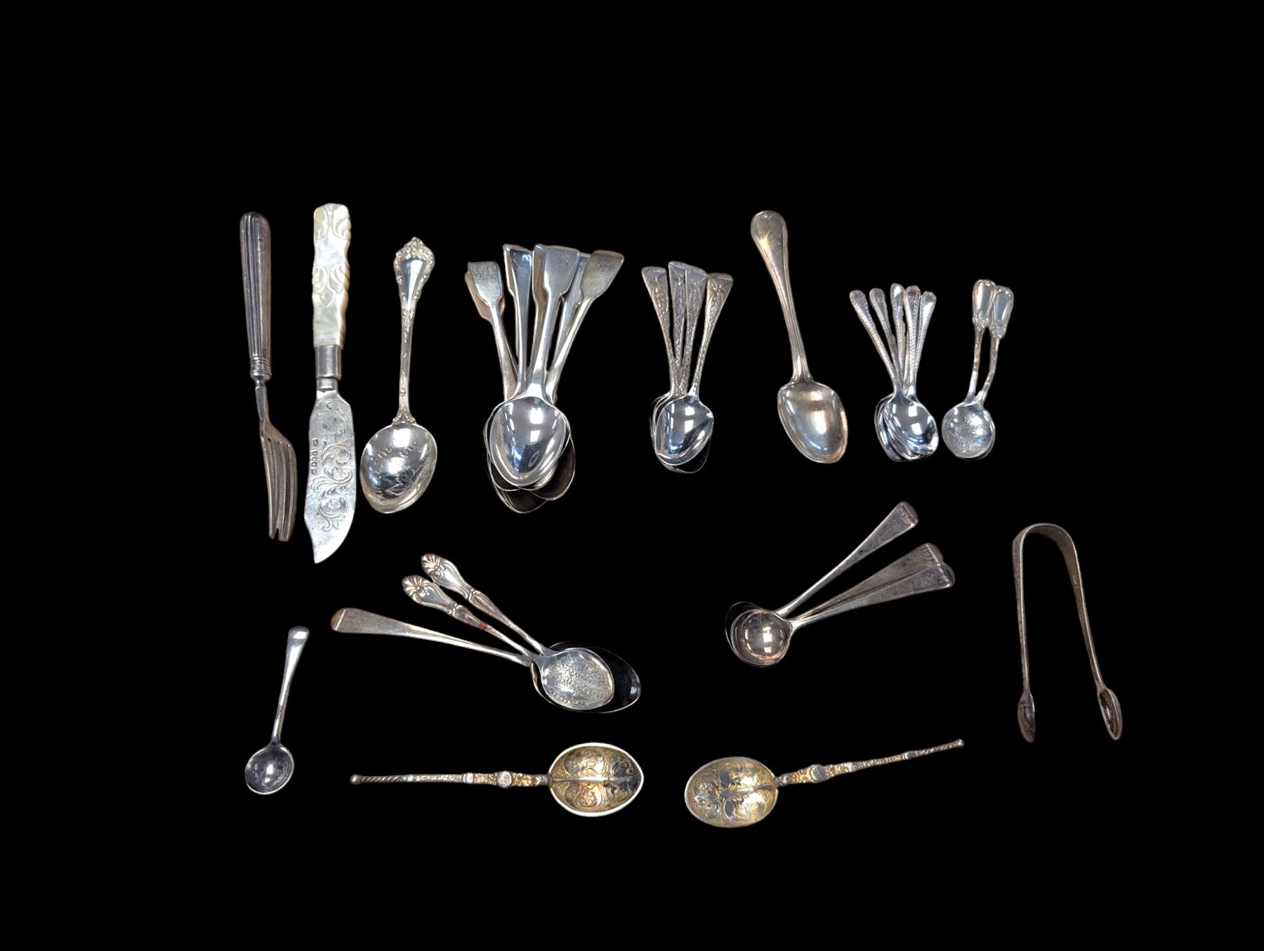 Collection of silver teaspoons, including souvenir and American silver examples, together with a silver handled fork and a mother of pearl handled silver knife, all stamped or hallmarked 