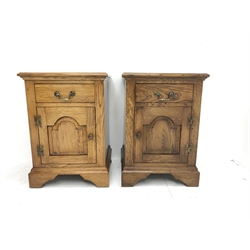Pair traditional medium oak bedside/lamp cabinets, fitted with cupboard and drawer, W46cm, D43cm, H64cm