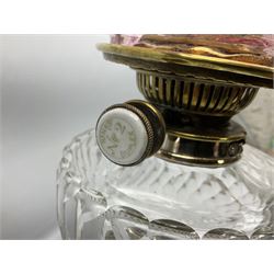 20th century Hawksworth, Eyre & Co silver plated oil lamp, the octagonal stepped base with engraved dedication, leading to an octagonal column supporting a faceted clear glass reservoir, Hinks Duplex burner, clear glass chimney, and cranberry glass shade, overall H71.5cm