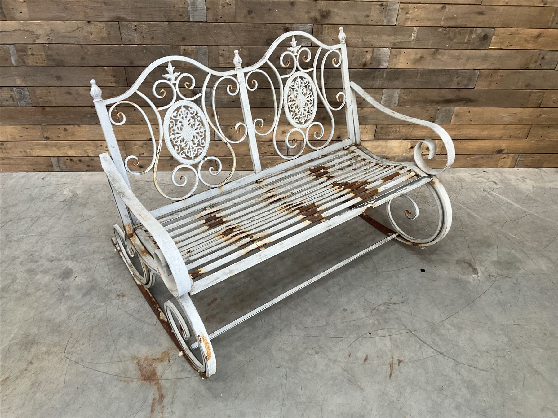 Wrought metal rocking garden bench seat, in antique grey finish