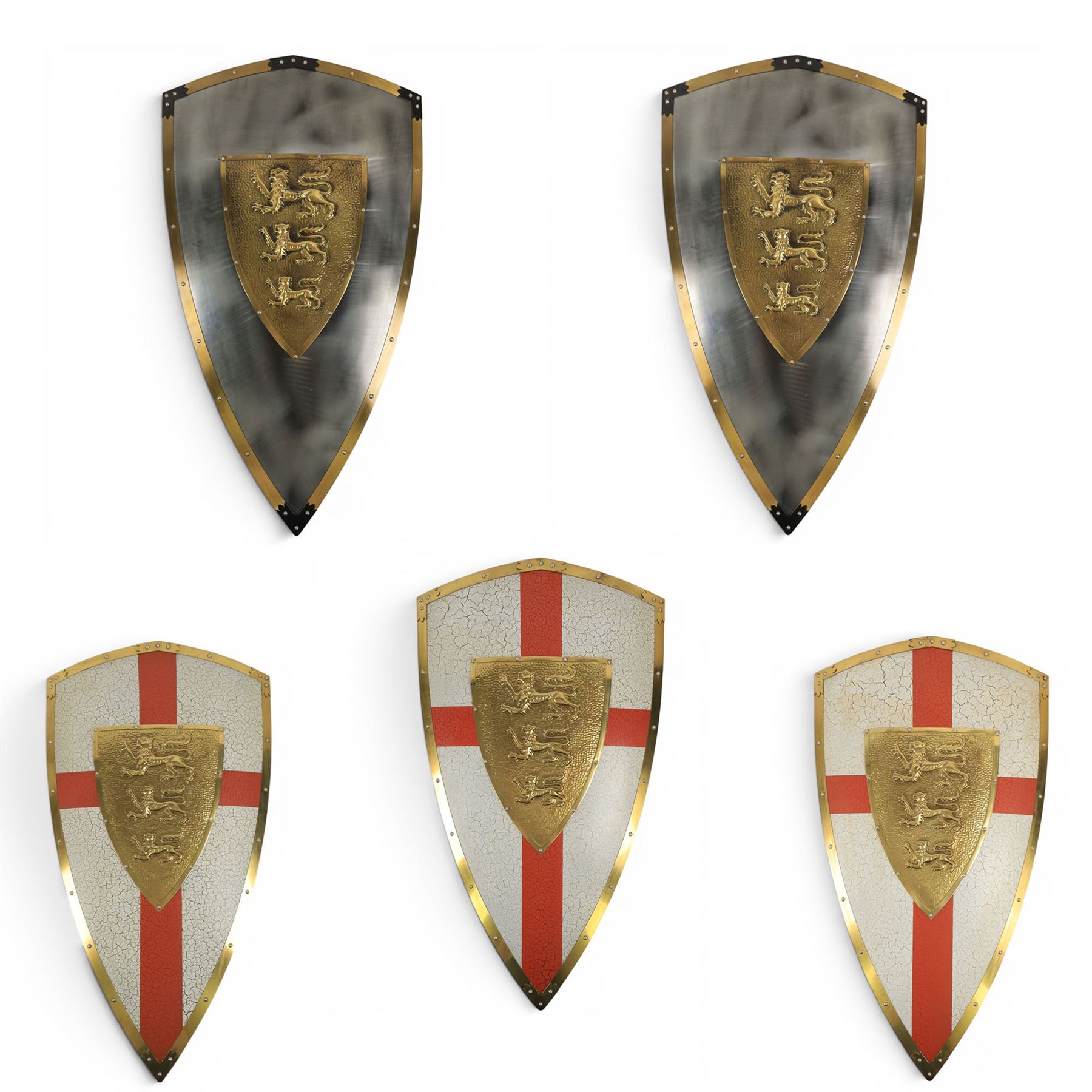 Five wall hangings, modelled as shields, decorated to the centre in relief with three lions 