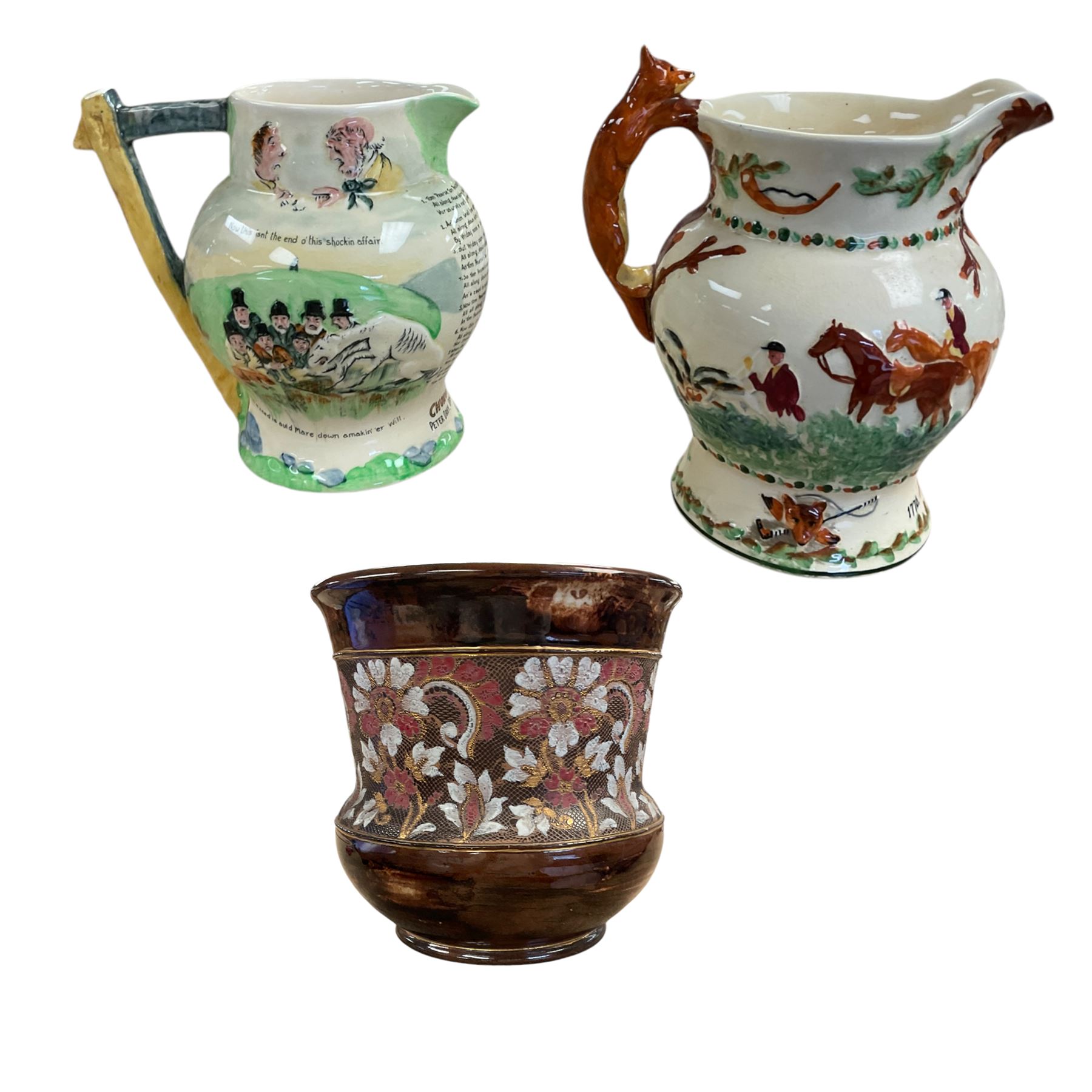 Two Crown Devon musical jugs, one depicting hunting scenes the other Widdicone Fair, together with Doulton of Lambeth of Slaters Patent Jardinière