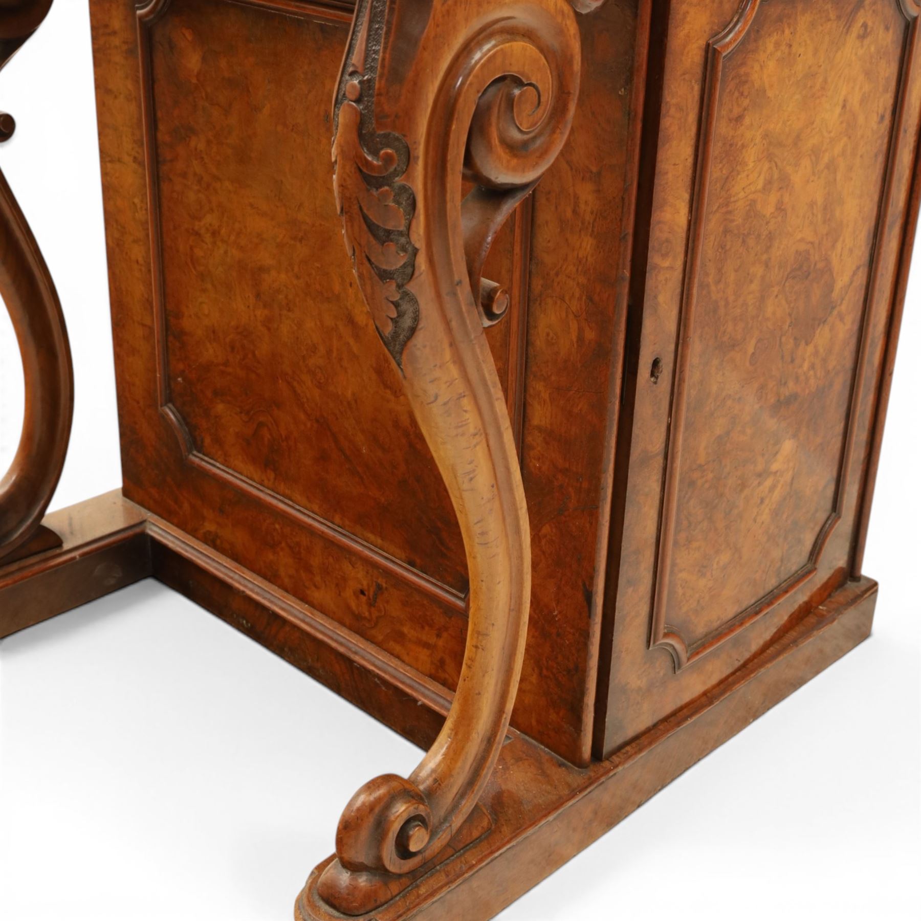 Victorian figured walnut Davenport, the fixed fall with drawer to the side enclosing writing compartment, green tooled leather writing inset, galleried back rail, right side fitted with four drawers behind a panel, opposing panelled side, raised on carved cabriole front supports with scroll terminals and platform base