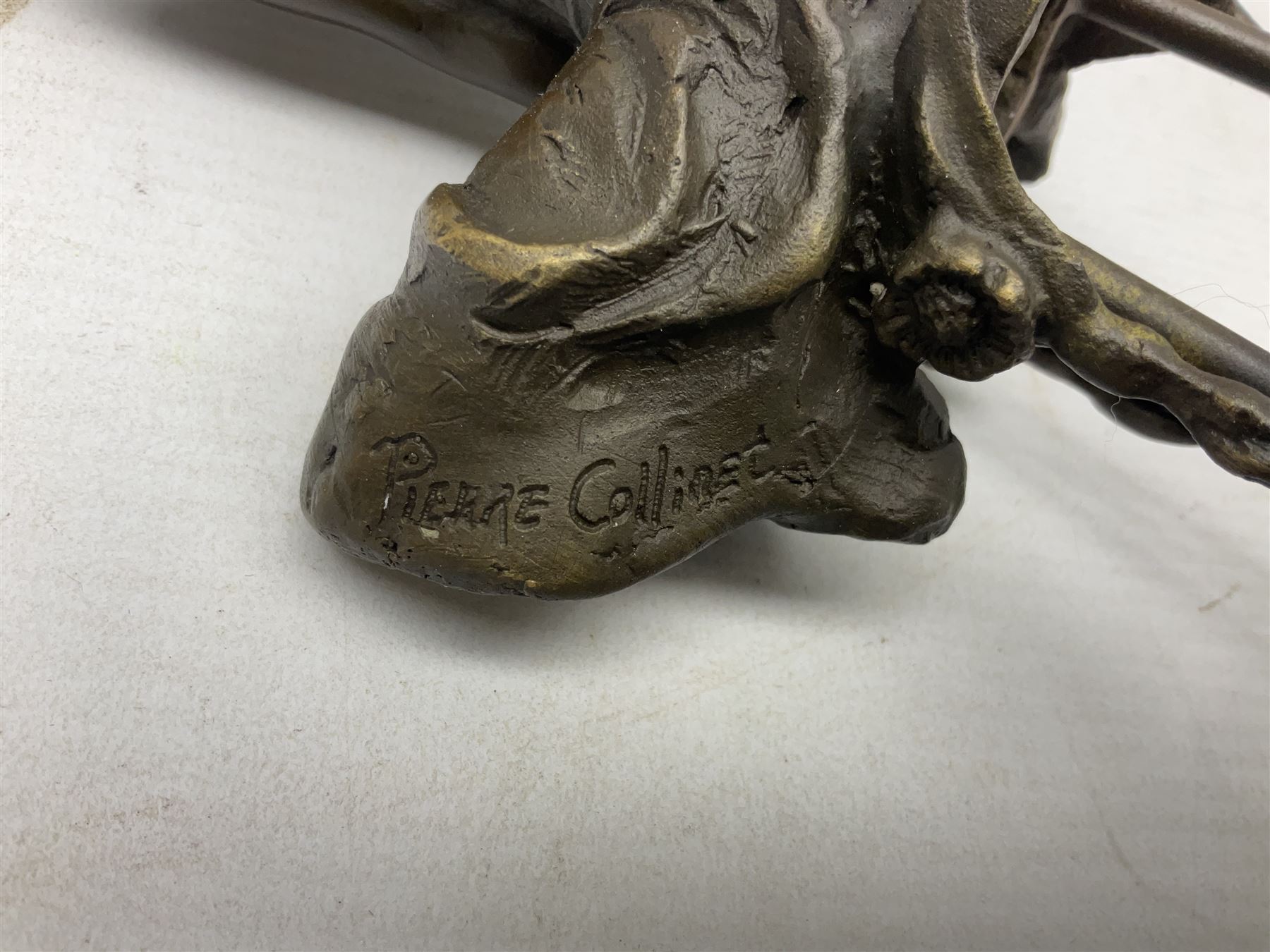 Art Deco style bronze modelled as a female figure seating crossed legged upon a chair, after Pierre Collinet, H28cm