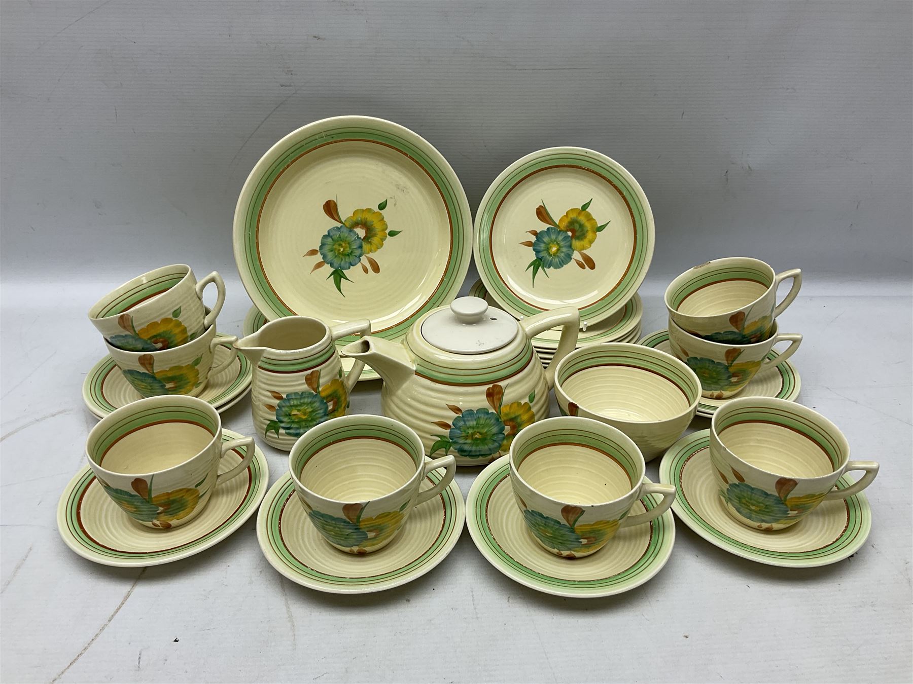 Wilkinson Clarice Cliff honeydew pattern tea service for eight, comprising teapot, milk jug, open sucrier, teacup and saucers, dessert plates and two side plates (29)