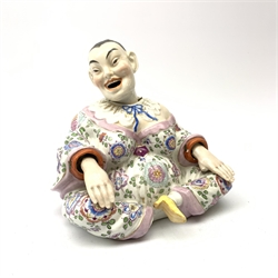 Late 19th century continental porcelain nodding pagoda figure, in the style of Dresden, modelled seated crossed legged, with moving head and hands, H14cm. 